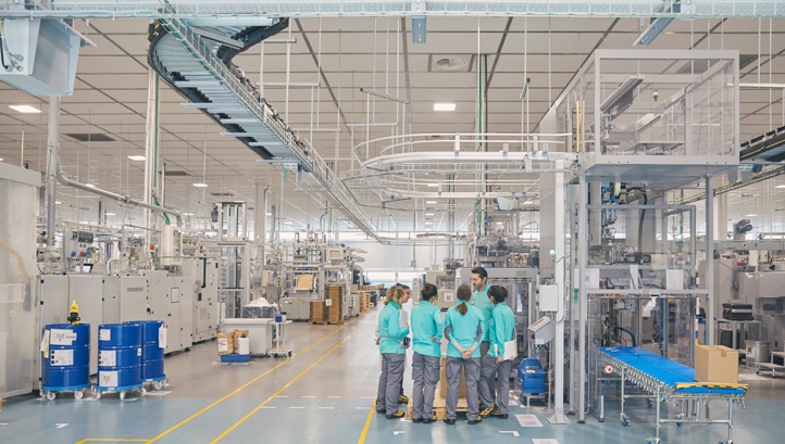 PMI workers at a factory in Bologna. Image: PMI